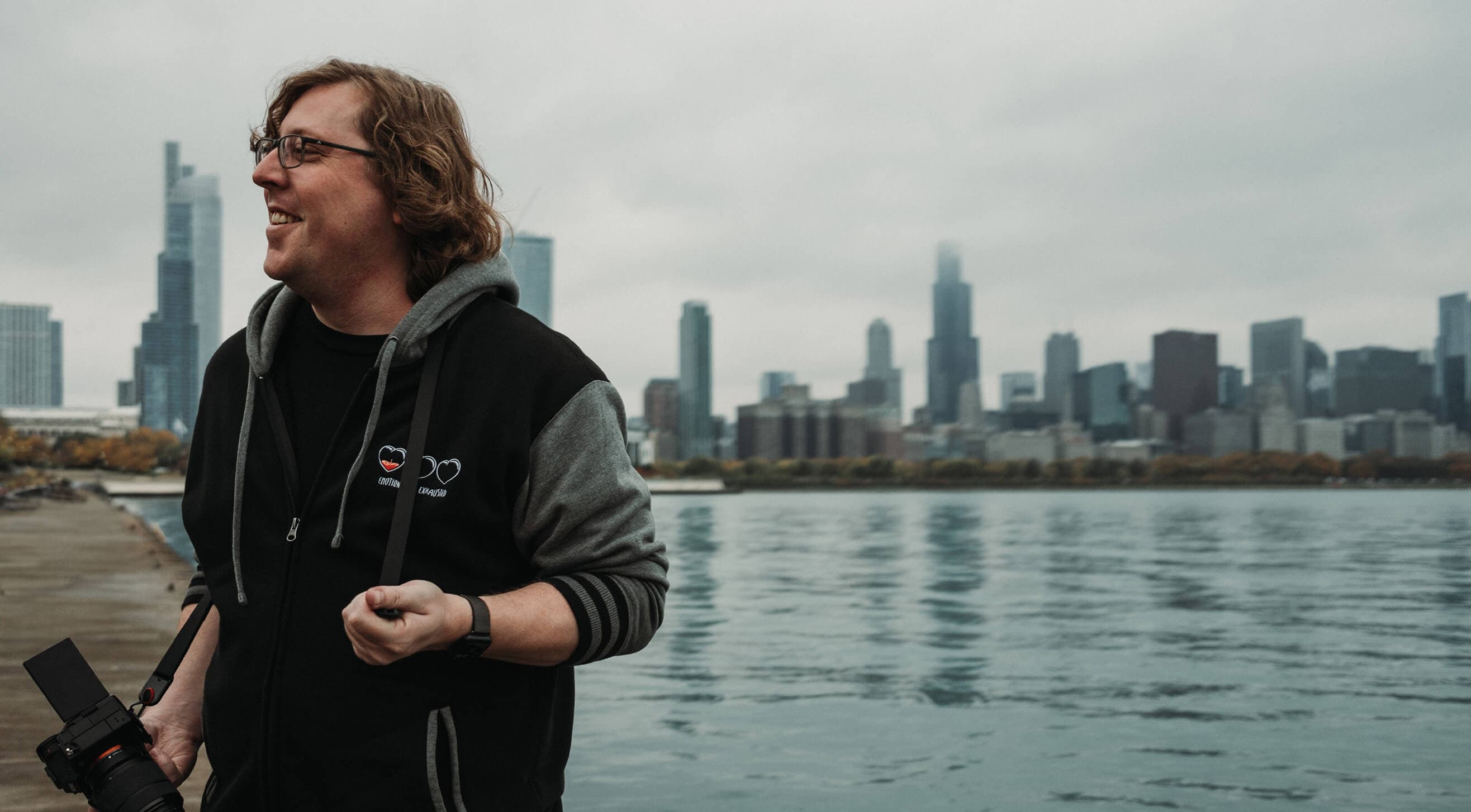 Josh Jones by the water front in Chicago with his camera